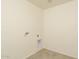 Laundry room with hookups and tile floor at 24520 W Duane Ln, Wittmann, AZ 85361