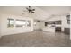 Open living area with vaulted ceilings, tile floors, and ceiling fan at 24520 W Duane Ln, Wittmann, AZ 85361