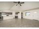Bright and airy living room with tile floors and a ceiling fan at 24520 W Duane Ln, Wittmann, AZ 85361