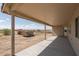 Covered patio overlooking the backyard at 24520 W Duane Ln, Wittmann, AZ 85361