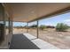 Covered patio with view of the desert landscape at 24520 W Duane Ln, Wittmann, AZ 85361