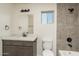 Clean bathroom with tile shower, vanity with quartz countertop, and toilet at 24604 W Duane Ln, Wittmann, AZ 85361