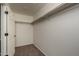 Spacious walk-in closet with double hanging rods at 24604 W Duane Ln, Wittmann, AZ 85361