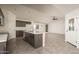 Open kitchen with island and views into the living room at 24604 W Duane Ln, Wittmann, AZ 85361