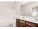 Bathroom featuring a tub-shower combo, dual sink vanity, and tile flooring at 2716 W Allens Peak Dr, San Tan Valley, AZ 85144