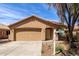 Charming single story house with a two-car garage, tile roof, and drought-tolerant landscaping at 2716 W Allens Peak Dr, San Tan Valley, AZ 85144