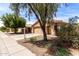 Single story house with a tile roof and a two-car garage complemented by low-maintenance landscaping at 2716 W Allens Peak Dr, San Tan Valley, AZ 85144