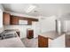 Functional kitchen with brown cabinets, white appliances, and an efficient layout for cooking at 2716 W Allens Peak Dr, San Tan Valley, AZ 85144