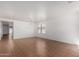 Expansive living room with tile flooring, white walls, and a chandelier for a bright and airy feel at 2716 W Allens Peak Dr, San Tan Valley, AZ 85144