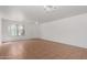 Open living space with tile floors, neutral walls, natural light, and a traditional chandelier at 2716 W Allens Peak Dr, San Tan Valley, AZ 85144