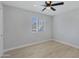 Bright bedroom with ceiling fan and hardwood floors at 285 W San Angelo St, Gilbert, AZ 85233