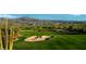 Golf course with sand traps and mountain views at 28623 N Sweep Ct, Rio Verde, AZ 85263