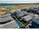 Aerial view of houses with pools, community lake, and park at 3146 E Sagebrush St, Gilbert, AZ 85296