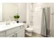 Clean bathroom with white vanity, bathtub, and striped shower curtain at 3146 E Sagebrush St, Gilbert, AZ 85296