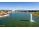 Community lake with fountain and silos in background at 3146 E Sagebrush St, Gilbert, AZ 85296