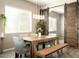 Dining area with a farmhouse-style table and sliding barn doors at 3146 E Sagebrush St, Gilbert, AZ 85296