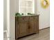 Simple entryway with a wooden console table and greenery at 3146 E Sagebrush St, Gilbert, AZ 85296