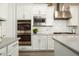 Modern kitchen with white cabinets, stainless steel appliances, and a gas cooktop at 3146 E Sagebrush St, Gilbert, AZ 85296