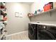 Laundry room with washer, dryer, and shelving for storage at 3146 E Sagebrush St, Gilbert, AZ 85296