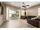 Living room with ceiling fan and access to backyard patio at 3146 E Sagebrush St, Gilbert, AZ 85296