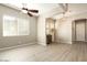 Bright and airy living room with a ceiling fan and large windows at 3146 E Sagebrush St, Gilbert, AZ 85296