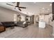 Open living room with gray sectional sofa and sliding glass doors at 3146 E Sagebrush St, Gilbert, AZ 85296