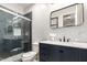 Modern bathroom with a walk-in shower and dark vanity at 3170 S Nebraska St, Chandler, AZ 85248