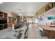 Open living room with tile floors and a view into the kitchen at 3816 E Grove Ave, Mesa, AZ 85206