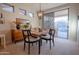 Dining area with a wooden table and access to the backyard at 41226 N Rolling Green Way, Anthem, AZ 85086