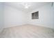 Simple bedroom featuring light flooring and a ceiling fan at 4356 E Evelyn St, Gilbert, AZ 85295