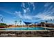 Relaxing pool area with lounge chairs and shade structures at 4356 E Evelyn St, Gilbert, AZ 85295