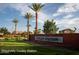 Community entrance sign with palm trees and landscaping at 4356 E Evelyn St, Gilbert, AZ 85295