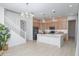 Modern kitchen with island and light wood cabinets at 4356 E Evelyn St, Gilbert, AZ 85295