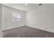 Spacious bedroom with neutral carpeting and large window at 511 W Pintail Dr, Casa Grande, AZ 85122