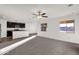 Open living room with kitchen island and ceiling fan at 511 W Pintail Dr, Casa Grande, AZ 85122