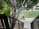 Stairs leading to a grassy backyard with trees and a grill at 520 N Stapley Dr # 290, Mesa, AZ 85203