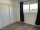 Spacious bedroom with large closet and vinyl flooring at 520 N Stapley Dr # 290, Mesa, AZ 85203