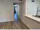 Bright hallway with wood-look flooring at 5236 W Peorioa Ave # 137, Glendale, AZ 85302
