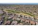 Aerial view of community with golf course and homes at 5363 S Emerald Desert Dr, Gold Canyon, AZ 85118