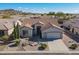Single-story home with desert landscaping and a two-car garage, aerial view at 5363 S Emerald Desert Dr, Gold Canyon, AZ 85118