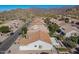 Aerial view showcasing community homes and mountain backdrop at 5363 S Emerald Desert Dr, Gold Canyon, AZ 85118