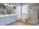 Bathroom with double vanity, soaking tub and shower at 5363 S Emerald Desert Dr, Gold Canyon, AZ 85118