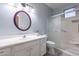 Bathroom with white vanity, oval mirror, and walk-in shower at 5363 S Emerald Desert Dr, Gold Canyon, AZ 85118