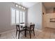 Charming breakfast nook with a round table and four chairs, adjacent to the kitchen at 5363 S Emerald Desert Dr, Gold Canyon, AZ 85118