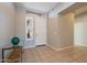 Bright and airy entryway with tile flooring and a glass-top accent table at 5363 S Emerald Desert Dr, Gold Canyon, AZ 85118
