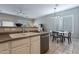 Kitchen with double sink, dishwasher, and eat-in area at 5363 S Emerald Desert Dr, Gold Canyon, AZ 85118