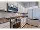 Kitchen with stainless steel appliances and white cabinets at 5363 S Emerald Desert Dr, Gold Canyon, AZ 85118