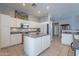 Kitchen with island, stainless steel appliances, and white cabinets at 5363 S Emerald Desert Dr, Gold Canyon, AZ 85118