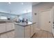 Kitchen with island, stainless steel appliances, and white cabinets at 5363 S Emerald Desert Dr, Gold Canyon, AZ 85118