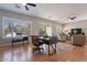 Spacious living area with hardwood floors, home office space and access to backyard at 5363 S Emerald Desert Dr, Gold Canyon, AZ 85118